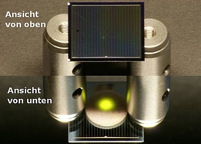 Eine zweiseitige Silicium-Solarzelle auf Aluminium-Zylindern wird von oben mit einem Infrarotlaser beleuchtet (Foto: Fraunhofer ISE)